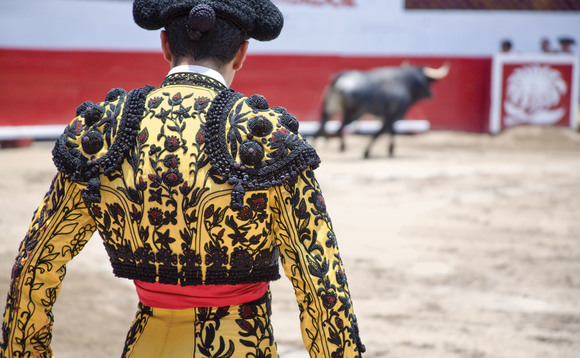 A Spanish matador fighting a bull