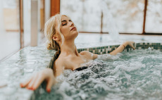 Woman relaxing in whirlpool bathtub