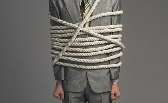 A businessman constricted by regulation A businessman constricted by regulation
