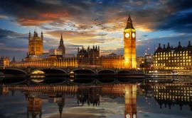 The Palace of Westminster and the Big Ben clock tower by the Thames river in London