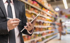 Manager checking inventory in supermarket