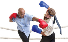 Businessmen boxing