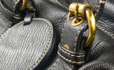Close-up of leather bag buckle