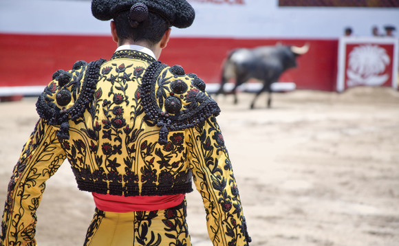 A Spanish matador fighting a bull A Spanish matador fighting a bull