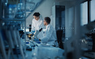Laboratory technicians at a biotechnology firm