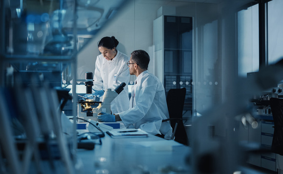 Laboratory technicians at a biotechnology firm