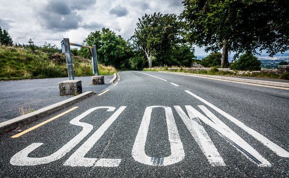 Warning sign painted on road