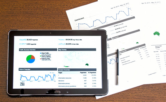 Business analytics software on tablet device Business analytics software on tablet device