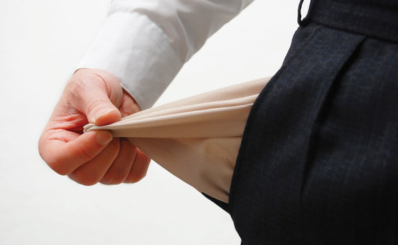 Close-up of a man showing empty pocket Close-up of a man showing empty pocket