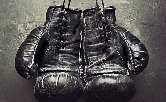 Top exec hangs up his gloves Top exec hangs up his gloves