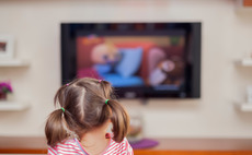 Little girl in front of TV